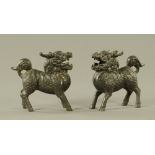 A pair of Chinese iron standing Fo Dogs, each height 16.5 cm, length 16.5 cm.