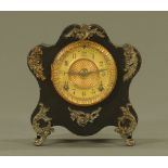 An Ansonia American tin plate cased mantle clock, with two train striking movement.