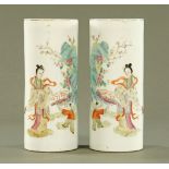 A pair of Chinese cylindrical vases, decorated with figures and fence with square seal mark to base.