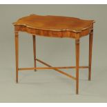 An Edwardian mahogany shaped occasional table,