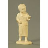 A Japanese Meiji period figure of a young boy in standing pose, rectangular seal mark to base.