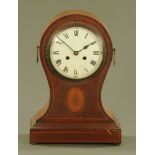A large Edwardian inlaid mahogany balloon clock, with two train movement.