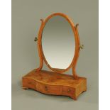 A 19th century mahogany and crossbanded serpentine fronted dressing table mirror.