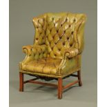 A George III style club type armchair,