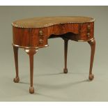 A mahogany kidney shaped desk circa 1930,