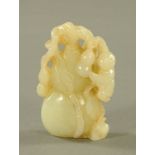 A Chinese Qianlong period jade carving, of a boy climbing a fruit tree. Height 10 cm.