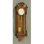 A Victorian walnut and ebonised twin weight Vienna type regulator wall clock,