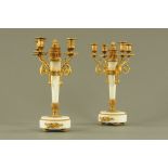 A pair of marble and gilt metal four branch candelabra. Height 39.5 cm, width +/- 19 cm.