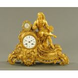A 19th century French ormolu mantle clock, with artist seated next to a portrait panel,