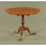 A George III oak circular tripod table,