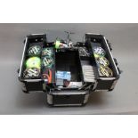 A McAllister tackle box, filled with fishing flies, fixed spool reel etc.