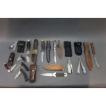 Collection of twelve fixed blade folding and multi tool knives, to include Frosts Mora,