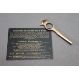 Army & Navy a gold lettered card relating to gun cleaning,