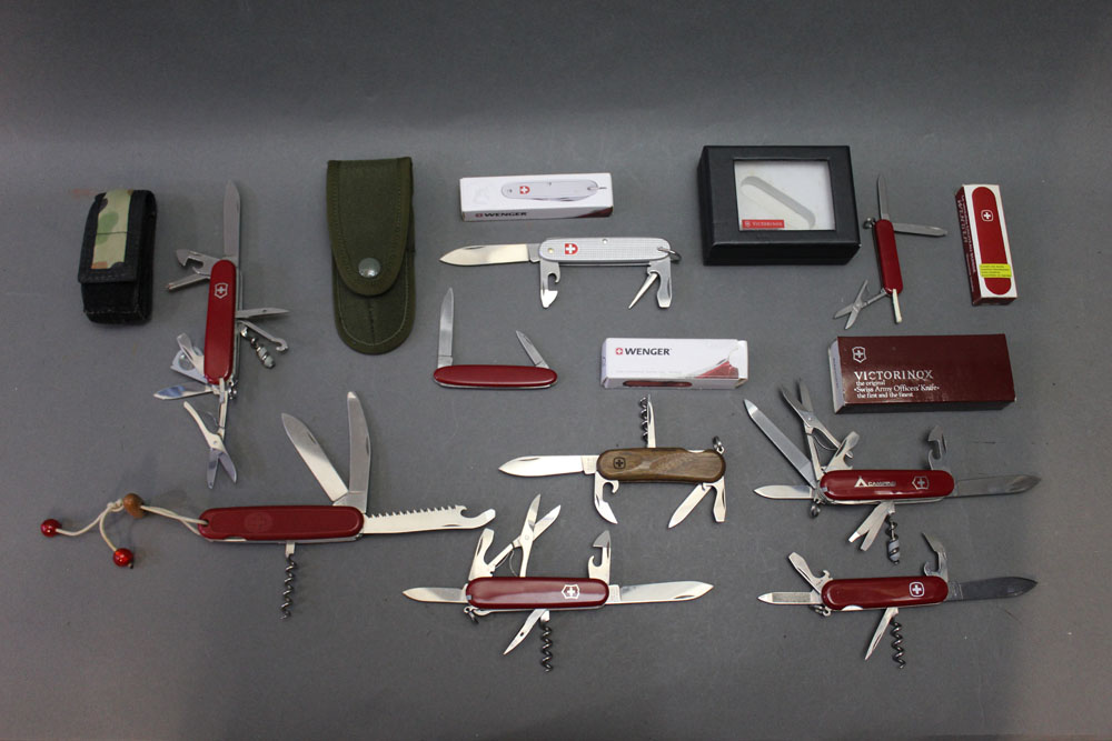 Nine Victorinox & Wenger Swiss Army knives.