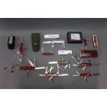 Nine Victorinox & Wenger Swiss Army knives.