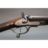 A 12 bore side by side hammer shotgun, with 30" Damascus barrels, cylinder and cylinder choke,