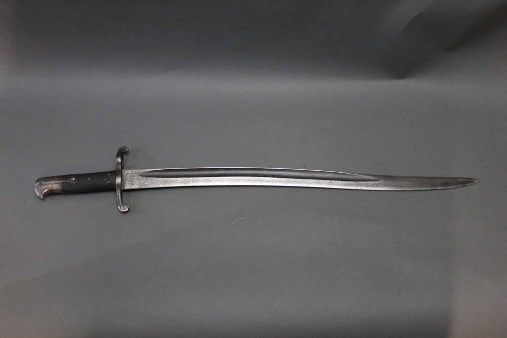A Pattern 1860 sword bayonet. Overall length 28", blade length 22 3/4".
