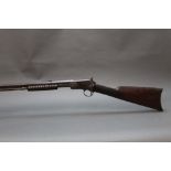 A Winchester Model 90 cal 22 short pump action rifle,