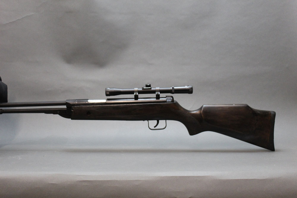 A Chinese cal 22 underlever air rifle, fitted with a 4 x 20 telescopic sight,