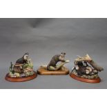 Border Fine Arts three otter figures, to include Otter With Creel dated 1999, signed Ayres,