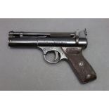 A Webley Premier cal 22 over lever air pistol, with red Bakelite grips,