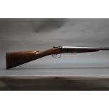 A Miroku 12 bore side by side shotgun, with 28" barrels, quarter and half choke, boxlock, ejector,