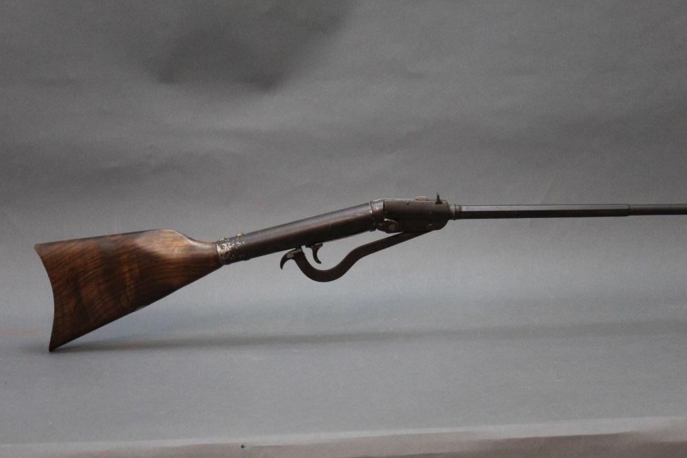 A Gem style air gun, cal 177, with half hexagonal barrel and fitted with a later stock.