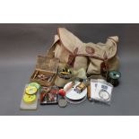 A vintage Worcestershire fly fishing bag and various pieces of tackle, Abu Tobys, Devon minnows,