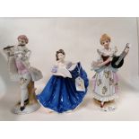 A Royal Doulton Pretty Ladies Elaine ornament together with two continental musician figural