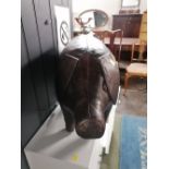 A stitched leather pig ornament or door stop manufactured by Omersa