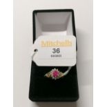 A 9ct gold cluster ring with pink stone,
