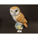A Beswick owl ornament with impressed 1046 mark to the base and green label