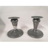 A pair of Tudric pewter candlesticks