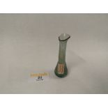 A glass lachrymatory bottle, possibly Roman,