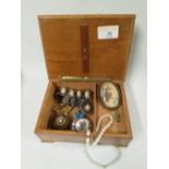 An inlaid wooden box of costume jewellery, to include a kingfisher brooch,