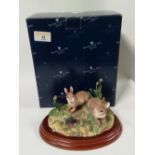 A boxed Border Fine Arts Country Characters "Surprise!" rabbit and mole ornament
