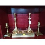 Two pairs of brass candlesticks and brass candle stand