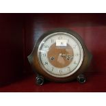 A vintage oak cased mantle clock with two train movement