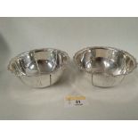 A pair of Birmingham silver bowls with embossed decoration