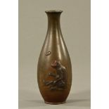 A Japanese bronze vase, decorated in relief with a chimpanzee and butterfly. Height 24.5 cm.