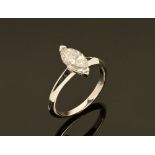 An 18 ct white gold solitaire diamond ring, set with a marquise cut diamond weighing +/- 1.