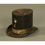 A rare College Toffee tin plate money box in the form of a top hat by W.M.