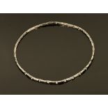 An 18 ct white gold collar necklace, set with diamonds weighing +/- 1.03 carats.