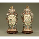 A pair of Chinese lidded vases of large form,