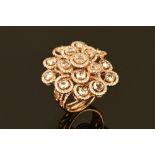A rose gold three tier floral diamond cluster ring,