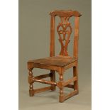 An 18th century primitive Chippendale style oak side chair, probably Yorkshire.