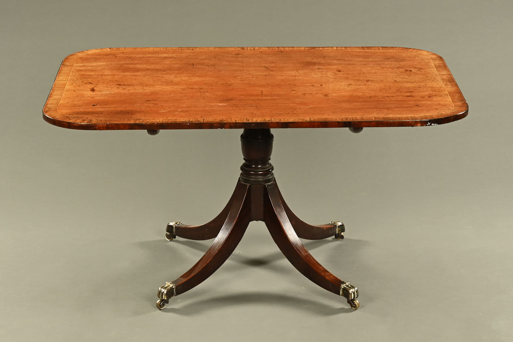 A George III mahogany breakfast table, rectangular with rounded corners and crossbanded edge,