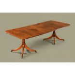 A George III style mahogany twin pillar dining table by William Tillman,