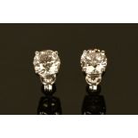 A large pair of 18 ct white gold diamond stud earrings, diamond weight +/- 3.09 carats in total.