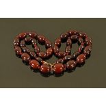 A cherry amber necklace, 53.6 grams.